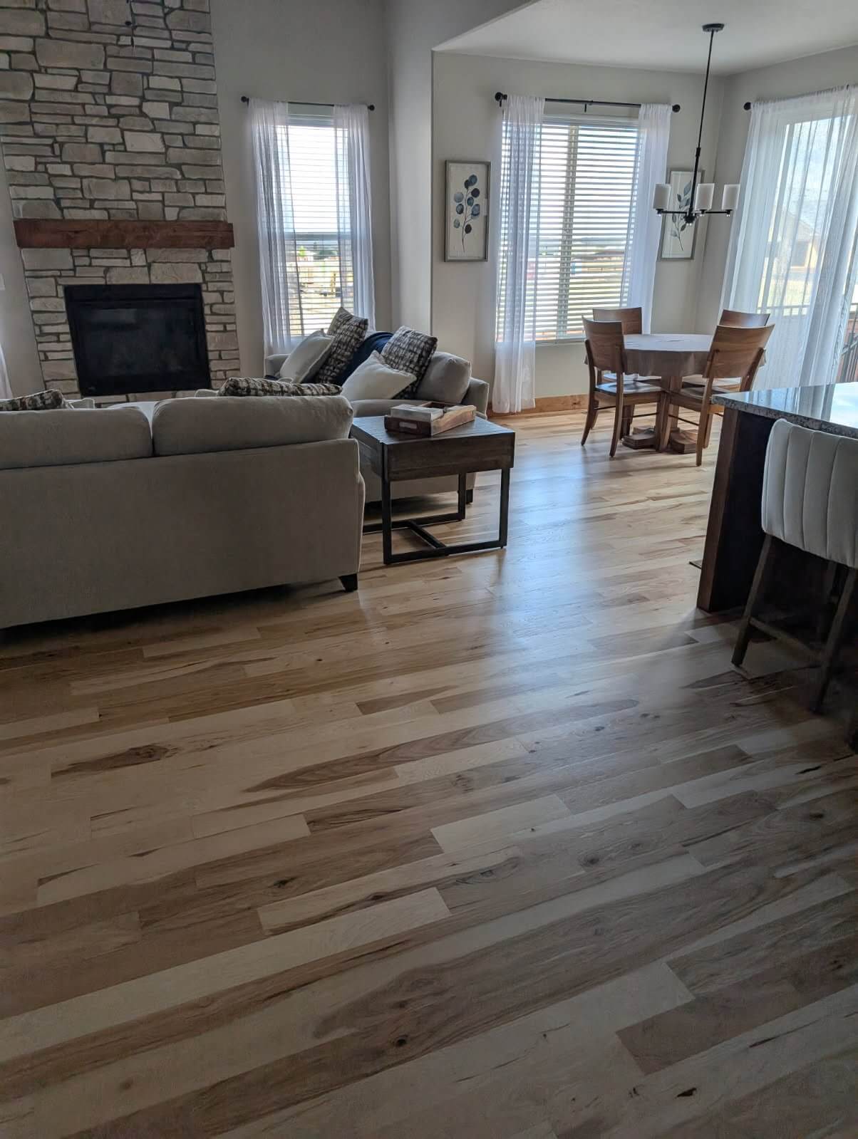 Furnished natural hardwood floor.
